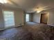 Inviting living area with neutral paint, plush carpeting, a ceiling fan, and natural light at 360 Meadowbrook Dr, Mcdonough, GA 30253