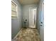 Mud room with tile floors, a window, door to the exterior, and laundry hookups at 360 Meadowbrook Dr, Mcdonough, GA 30253