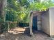 Exterior view of a utility shed with corrugated metal siding, showcasing a functional backyard storage space at 360 Meadowbrook Dr, Mcdonough, GA 30253