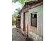 Exterior view of shed featuring its corrugated metal siding and painted door at 360 Meadowbrook Dr, Mcdonough, GA 30253