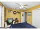 Cozy bedroom with a chair, fan, and decor at 3435 Pierce Arrow Cir, Suwanee, GA 30024