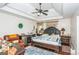 Bedroom featuring a fan, furnishings, and decor at 3435 Pierce Arrow Cir, Suwanee, GA 30024