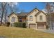 Charming two-story home with a well-manicured lawn and a two-car garage at 3435 Pierce Arrow Cir, Suwanee, GA 30024