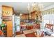 Well-equipped kitchen featuring wood cabinets and an adjacent dining space at 3435 Pierce Arrow Cir, Suwanee, GA 30024
