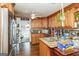 Kitchen with wood cabinets, granite countertops, and stainless steel appliances at 3435 Pierce Arrow Cir, Suwanee, GA 30024