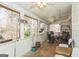 Enclosed sunroom with multiple windows and various seating arrangements, perfect for relaxation at 3435 Pierce Arrow Cir, Suwanee, GA 30024