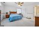 Comfortable bedroom with neutral carpet, a double bed, and ample closet space, offering a relaxing retreat at 2200 Gleneagle Nw Ct, Conyers, GA 30012