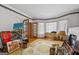 Bright and airy living space with beautiful hardwood floors and decorative ceiling trim at 2200 Gleneagle Nw Ct, Conyers, GA 30012