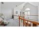 Bright upper hallway with carpeted floors, with railings, great natural light and room for relaxing at 2200 Gleneagle Nw Ct, Conyers, GA 30012