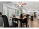 Bright breakfast nook with large windows, ceiling fan, wood floors, and a cozy atmosphere at 2612 New Haven Dr, Jonesboro, GA 30236