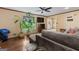 Bright living room with large windows, hardwood floors, and a sectional sofa, perfect for relaxation and entertainment at 2612 New Haven Dr, Jonesboro, GA 30236