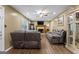 Spacious living room boasts a cozy fireplace, hardwood floors, and a ceiling fan at 2612 New Haven Dr, Jonesboro, GA 30236