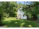 Charming shed set in a large, private backyard surrounded by mature trees and green grass at 2612 New Haven Dr, Jonesboro, GA 30236