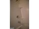 Close up of the bath/shower with tiled walls and chrome fixtures at 6342 Kinsland Ct, Lithonia, GA 30058