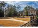 Community playground with slide and climbing structure on a sunny day at 6342 Kinsland Ct, Lithonia, GA 30058