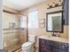 Bathroom with tiled walk-in shower and updated vanity at 8 Cameron St, Moreland, GA 30259