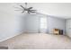 Comfortable bedroom featuring neutral walls, carpeted floors, and bright window with sheer curtains at 8 Cameron St, Moreland, GA 30259