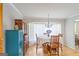Charming dining area with wood floors, decorative hutch, and bay window bringing in lots of light at 8 Cameron St, Moreland, GA 30259