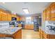 Spacious kitchen with granite countertops, stainless steel appliances, and ample cabinet space at 8 Cameron St, Moreland, GA 30259