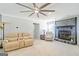 Cozy living room featuring a stone fireplace, plush seating, and ample natural light at 8 Cameron St, Moreland, GA 30259