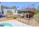 Outdoor pool area highlighting a rustic bar with a seating area, perfect for entertaining guests at 8 Cameron St, Moreland, GA 30259
