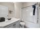 Bathroom features vanity and tub shower combo with bronze fixtures at 2441 Noelle Ln, Powder Springs, GA 30127