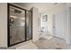 Bathroom featuring separate glass shower and soaking tub with picture window view at 2441 Noelle Ln, Powder Springs, GA 30127
