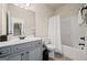 Bathroom features a vanity with a dark faucet and a shower tub combo at 2441 Noelle Ln, Powder Springs, GA 30127