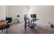 Bright bedroom with a workspace featuring a dark desk and a comfortable chair at 2441 Noelle Ln, Powder Springs, GA 30127