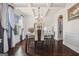 Elegant dining room with coffered ceiling, chandelier, and stylish furnishings at 2441 Noelle Ln, Powder Springs, GA 30127