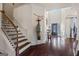 Bright foyer with hardwood floors, staircase, high ceilings, and elegant decor at 2441 Noelle Ln, Powder Springs, GA 30127