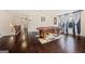 A game room featuring a pool table and hardwood floors that leads to a hallway and staircase at 2441 Noelle Ln, Powder Springs, GA 30127