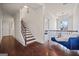 Bright hallway with dark hardwood floors and a stairway leading to the second floor at 2441 Noelle Ln, Powder Springs, GA 30127