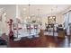 Modern kitchen featuring a breakfast bar with stylish seating and an adjacent dining area with dark wood floors at 2441 Noelle Ln, Powder Springs, GA 30127