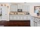 Well-appointed kitchen featuring white cabinetry, granite countertops, and modern appliances at 2441 Noelle Ln, Powder Springs, GA 30127