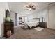 Large main bedroom with a ceiling fan, sitting area, and sheer curtains for natural light at 2441 Noelle Ln, Powder Springs, GA 30127