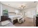 Spacious main bedroom featuring a large bed, decorative furniture, and soft natural light at 2441 Noelle Ln, Powder Springs, GA 30127