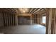 Unfinished basement with concrete floor, exposed framing, and a window for natural light at 336 Traditions Ln # 147, Hampton, GA 30228