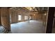 Spacious unfinished basement with exposed wood framing, concrete floor and natural light from windows at 336 Traditions Ln # 147, Hampton, GA 30228