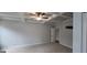 Spacious primary bedroom with coffered ceiling and a doorway to closet at 336 Traditions Ln # 147, Hampton, GA 30228