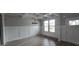 Dining room with gray walls, wood floors, coffered ceilings, and natural light at 336 Traditions Ln # 147, Hampton, GA 30228