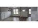 The dining room features gray walls, a chandelier, and a coffered ceiling at 336 Traditions Ln # 147, Hampton, GA 30228