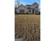 A two-story brick house with a large yard is ready to become a home at 336 Traditions Ln # 147, Hampton, GA 30228