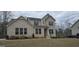Beautiful two-story brick home with professionally landscaped yard and manicured lawn at 336 Traditions Ln # 147, Hampton, GA 30228