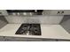 Close up of kitchen featuring a gas cooktop and subway tile backsplash at 336 Traditions Ln # 147, Hampton, GA 30228