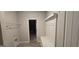 Mudroom with coat rack/bench next to closet providing ample storage solutions at 336 Traditions Ln # 147, Hampton, GA 30228