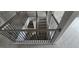 Detailed staircase featuring light wood treads, white risers, and ornate black iron railing with wood accents at 336 Traditions Ln # 147, Hampton, GA 30228