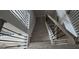 Detailed staircase featuring light wood treads, white risers, and ornate black iron railing with wood accents at 336 Traditions Ln # 147, Hampton, GA 30228