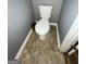 Toilet on tile floor with neutral walls, and white trim at 2976 Vining Ridge Ln, Decatur, GA 30034