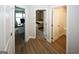 Upstairs hallway with three doorways leading to a home office, bedroom, and bathroom at 3579 Silvery Way, Powder Springs, GA 30127